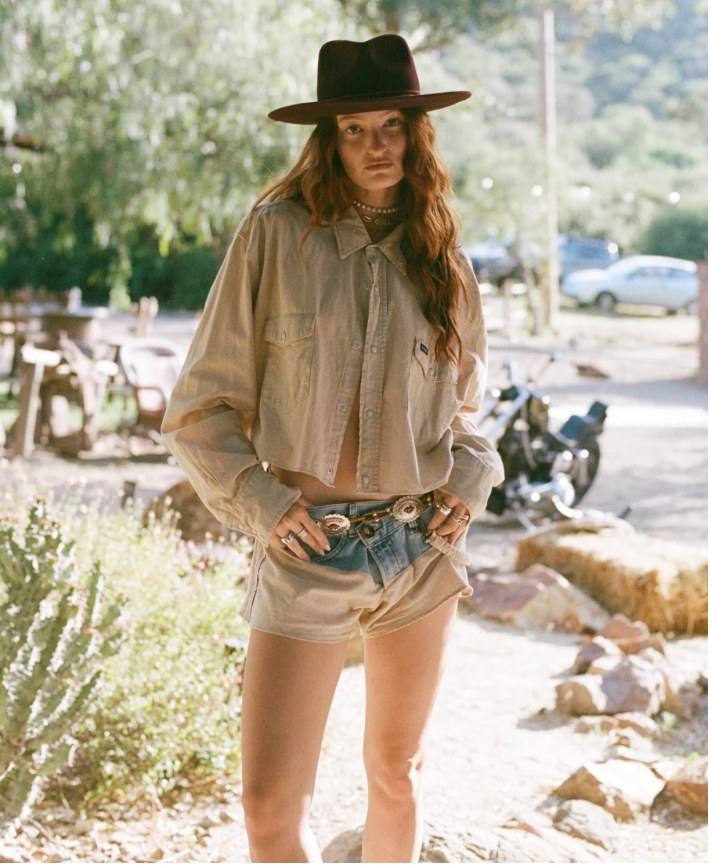 Film — khaki shirt and denim shorts by the ranch road